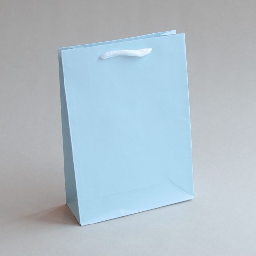 Presentpåsar i blå och gröna nyanser