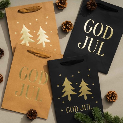 Julklappspåsar med guldfärgade julgranar