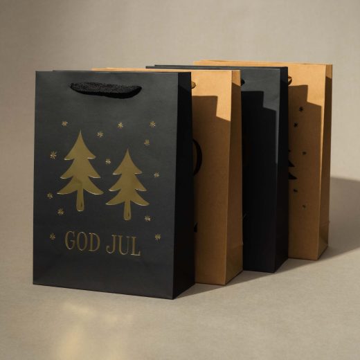Julklappspåsar med guldtryck för försäljning